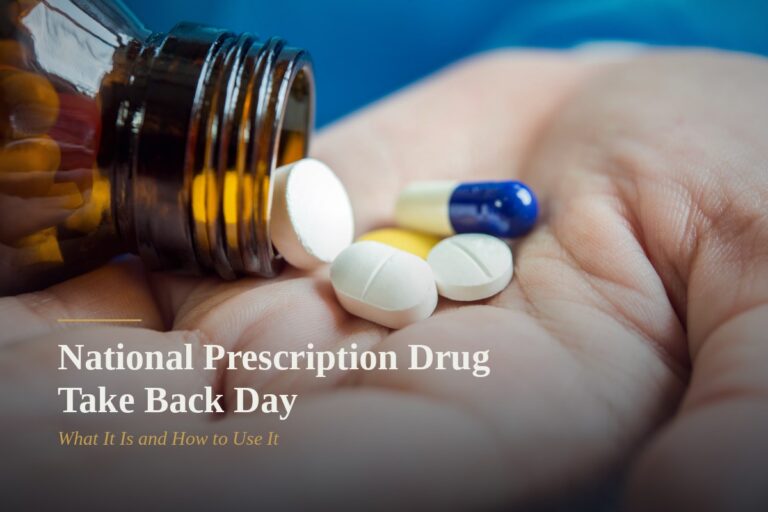 Hand holding pills spilled from a prescription bottle, representing National Prescription Drug Take Back Day